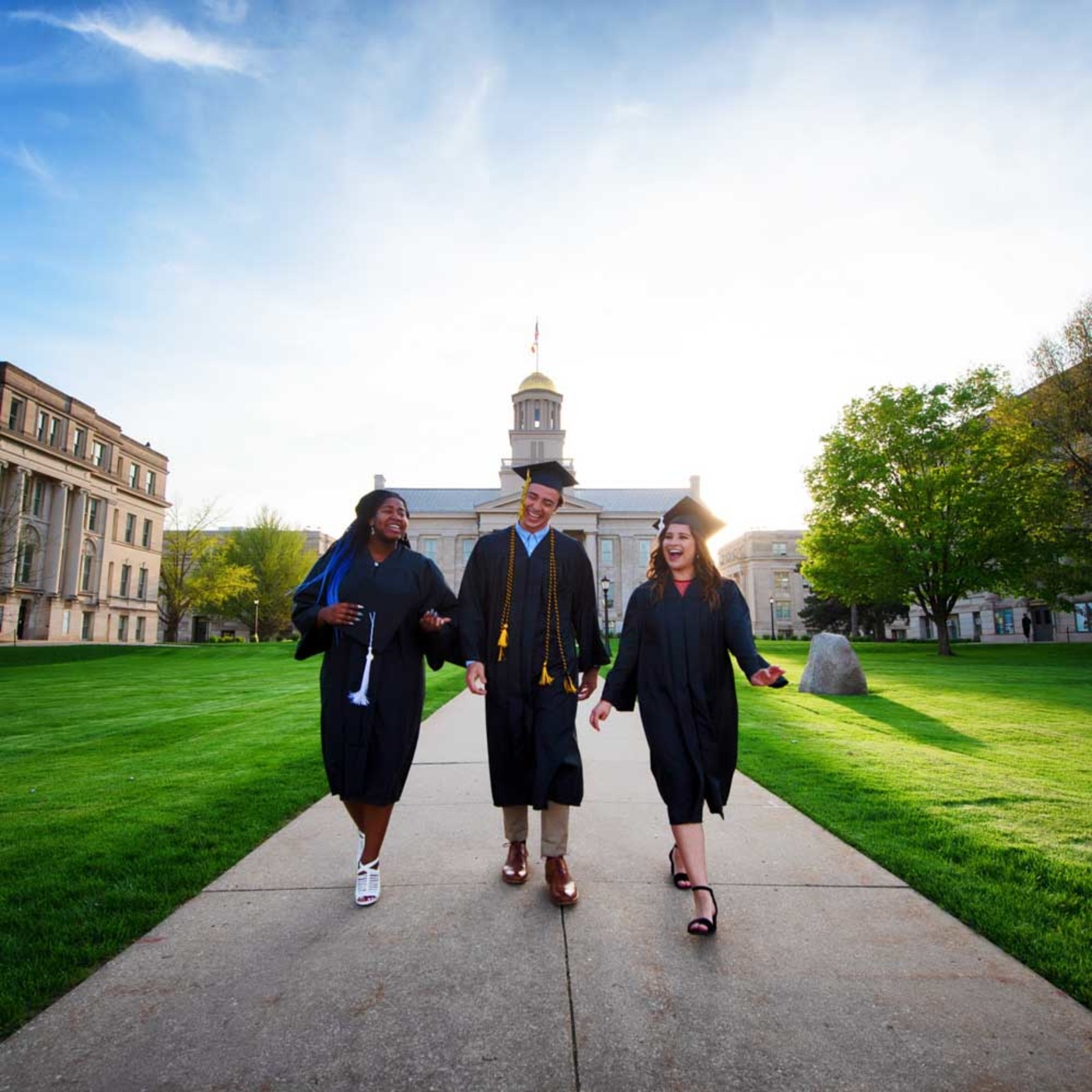 graduates walking on campus